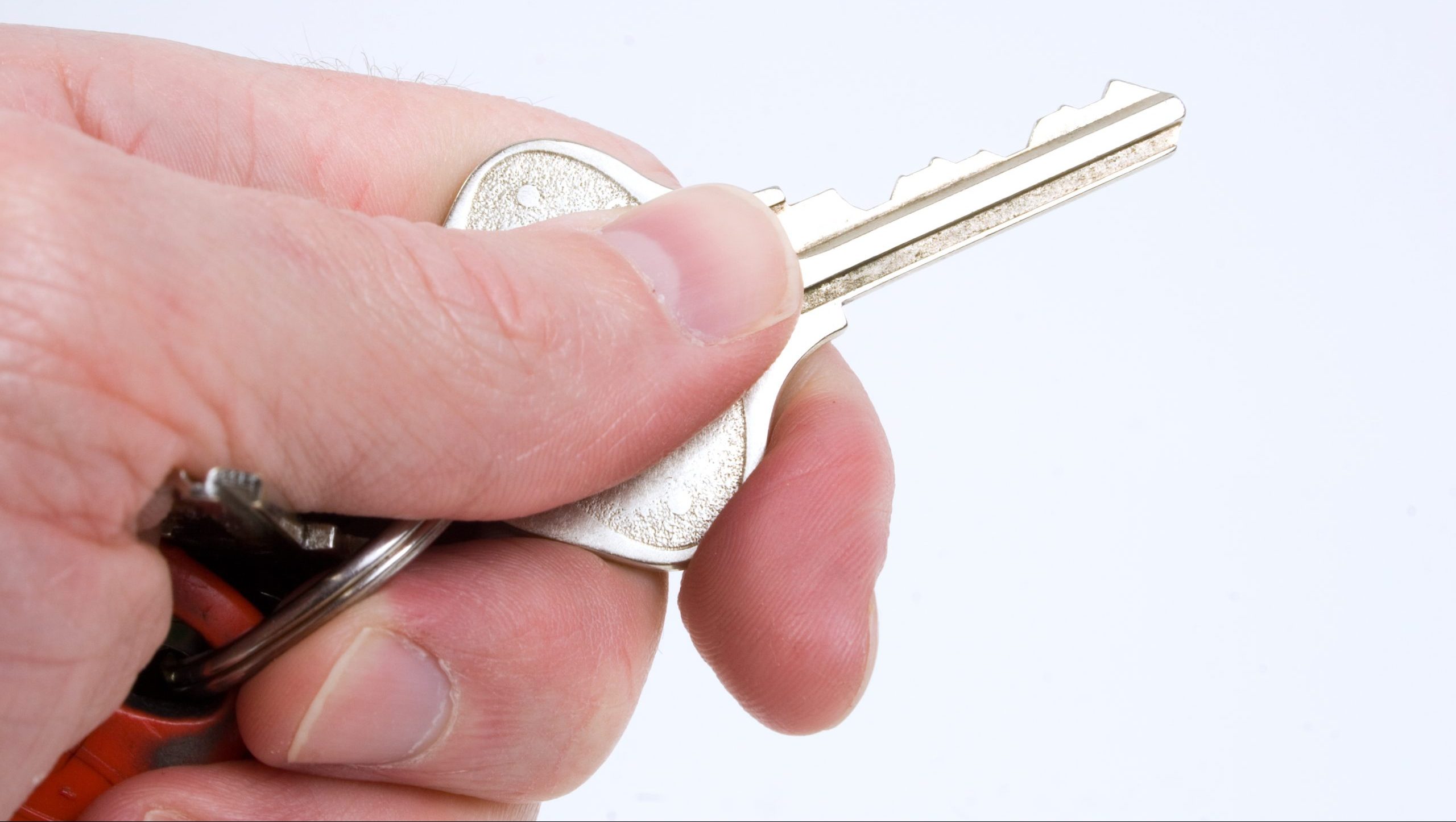 A hand holding a key