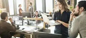 BusinessStorage_Images An office woman showing her laptop to a colleague