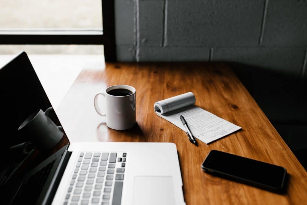 laptop and coffee on table