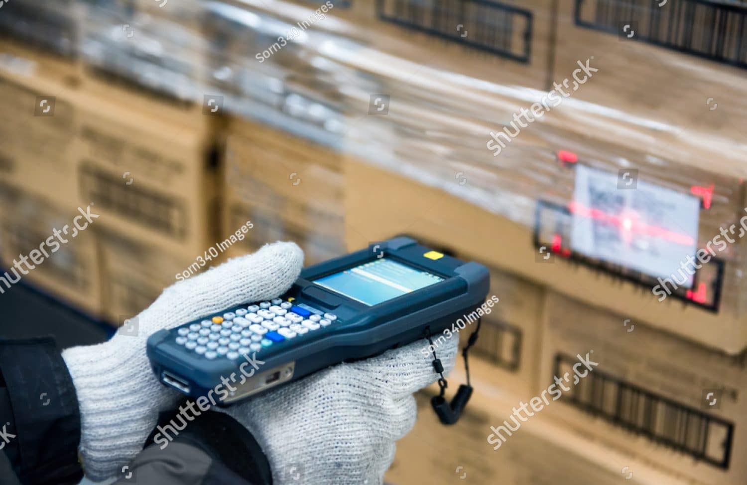 A warehouse worker scanning boxes
