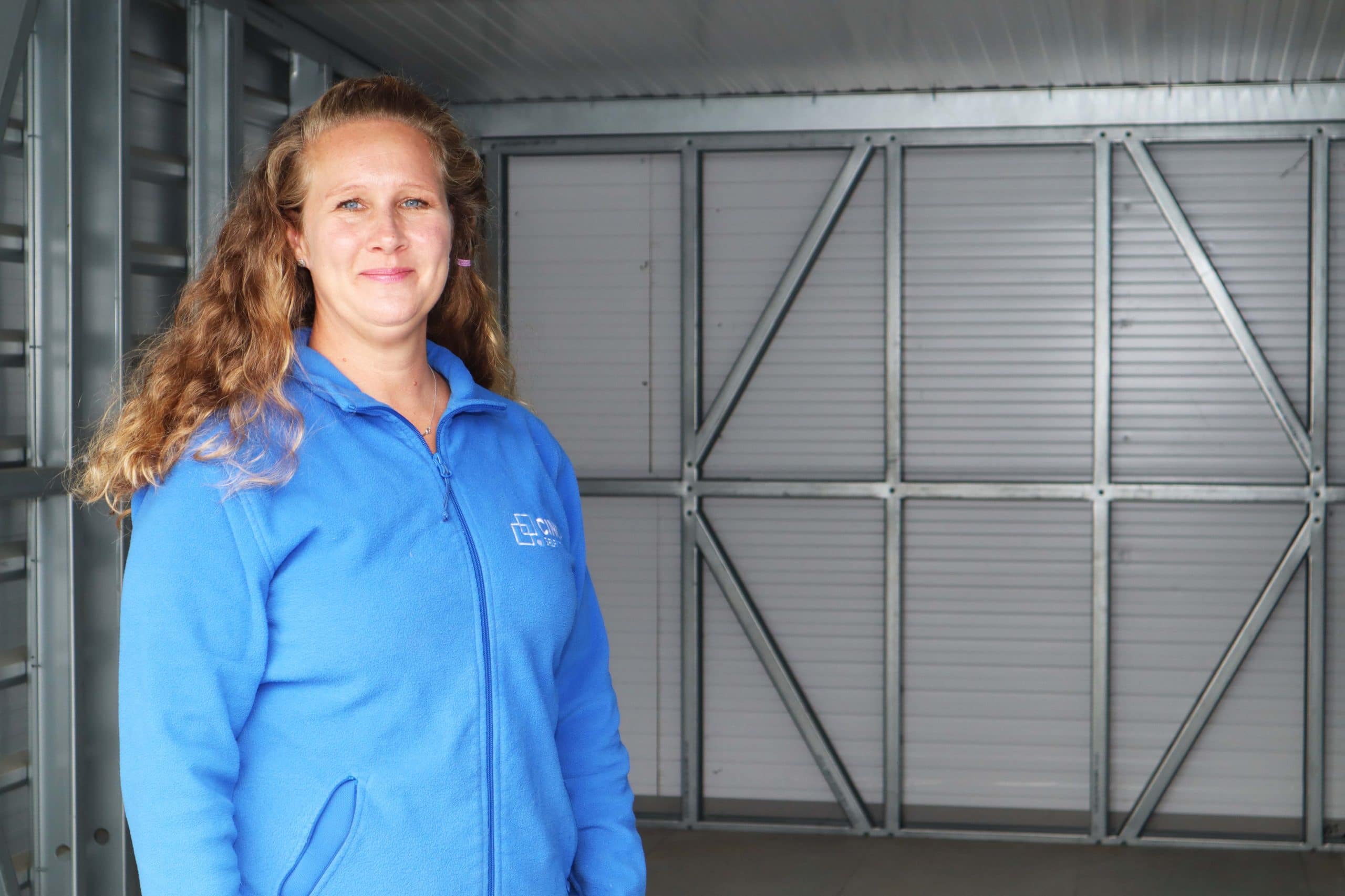 Woman Standing In Front of Storage Unit for Business Storage Enfield