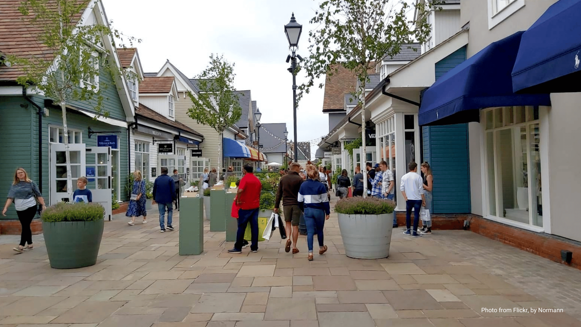 Bustling main street of local shopping village in Bicester