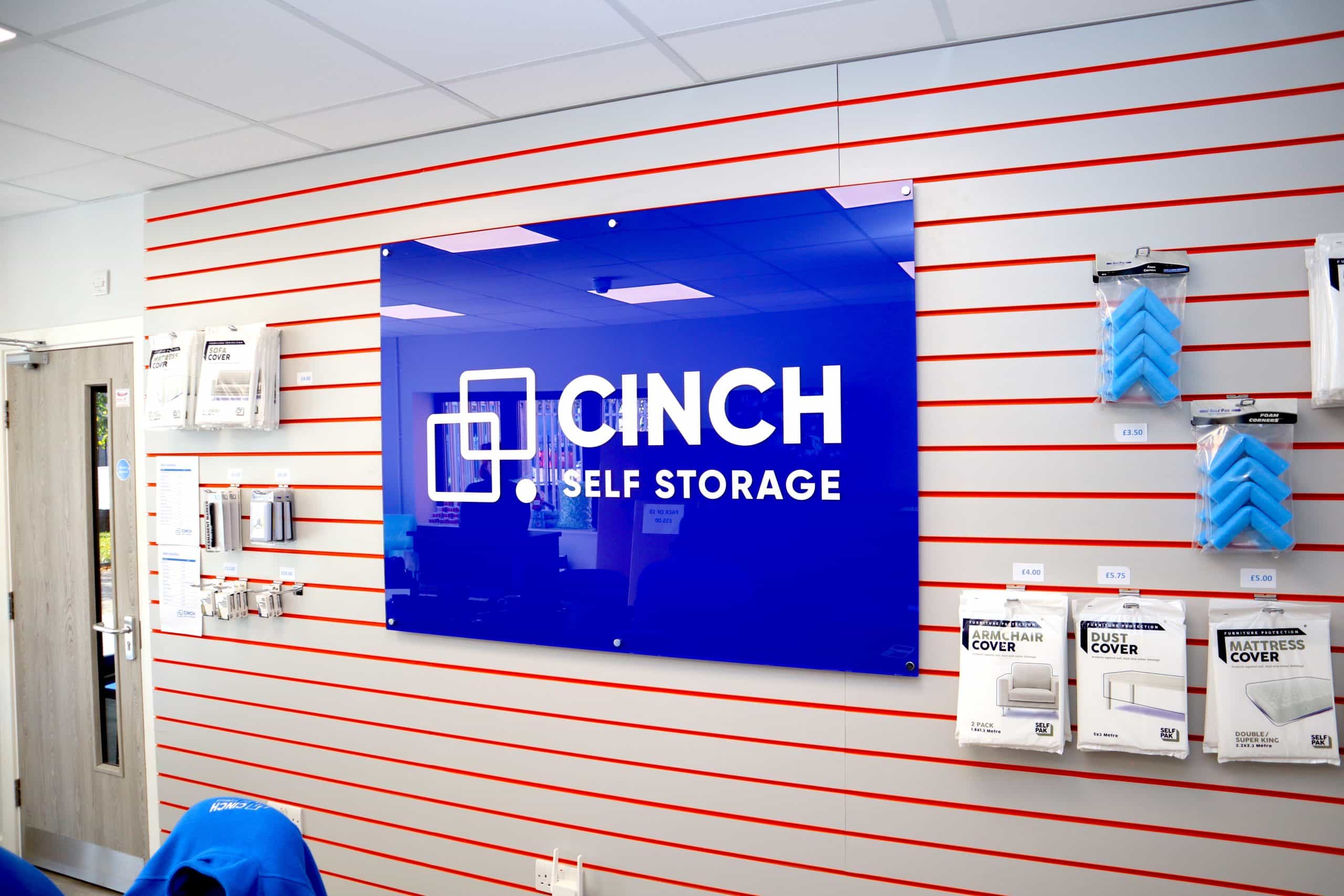 Sign reading Cinch Self Storage on wall at business storage Sittingbourne facility