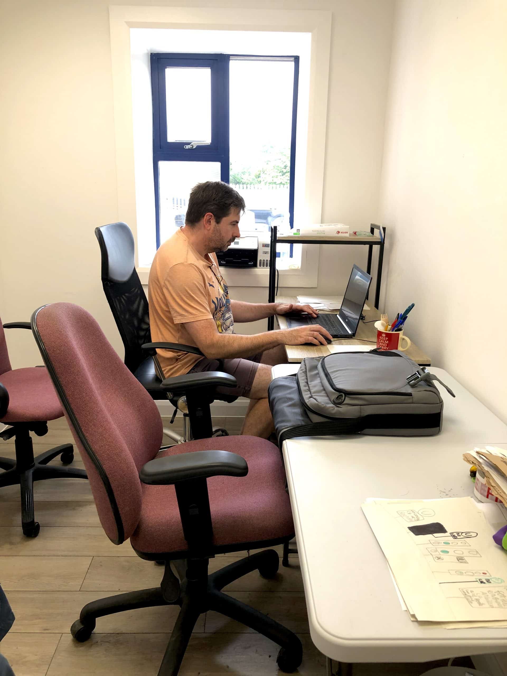 Employee at a desk in an office space