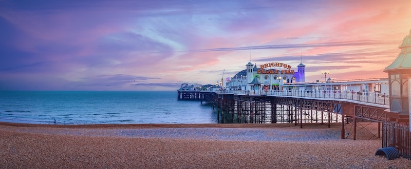 Top things to do in Brighton. Image shows Brighton Pier, UK during sunset England