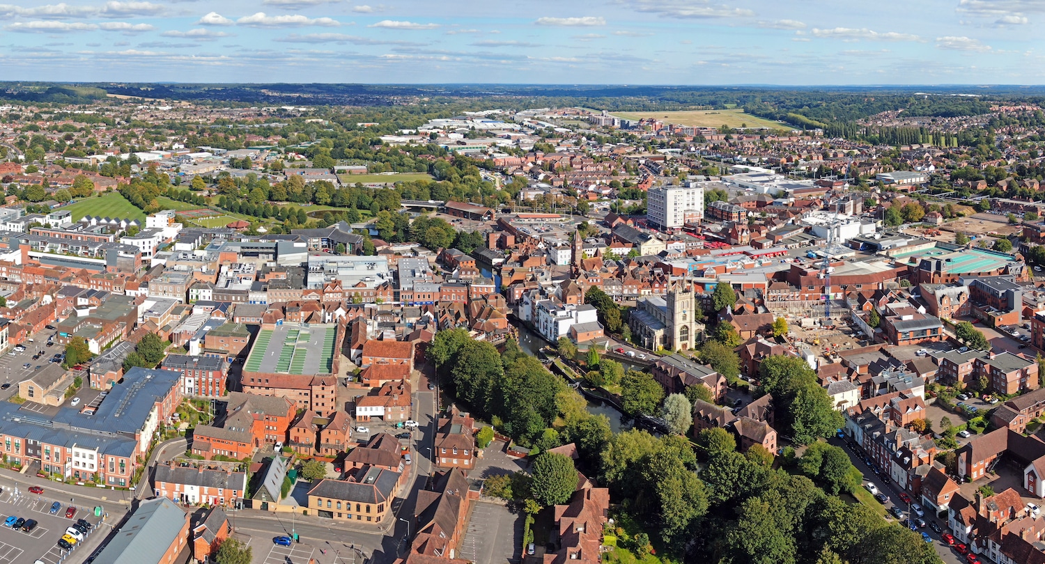 5 Best towns and villages to live near Newbury. Aerial view of Newbury Town in Berkshire