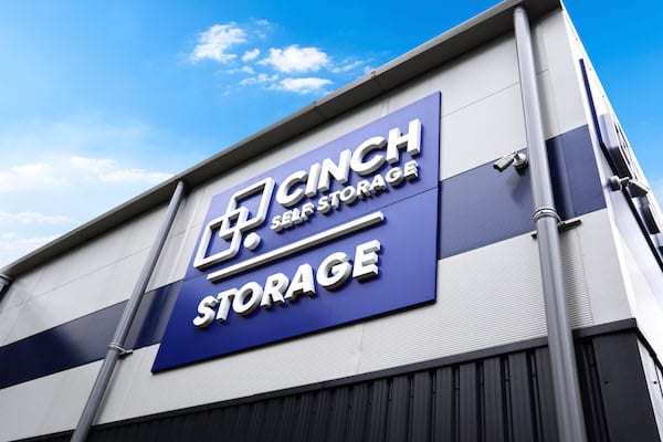 5 Key benefits of self storage in Mitcham. Image shows large blue Cinch Self Storage sign on the side of the storage facility building.