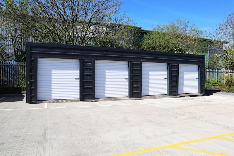 Indoor vs outdoor storage, which one is best? Image shows a row of drive-up outdoor storage units.