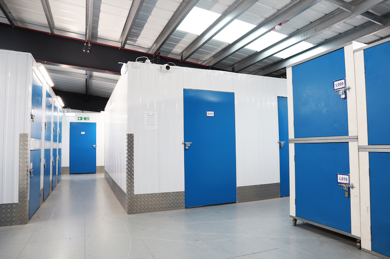 Storage unit Sidcup. Image shows the interior of a storage unit facility with storage units with blue doors