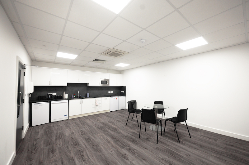 What are serviced offices. Image shows the interior of a kitchen that is used by serviced offices