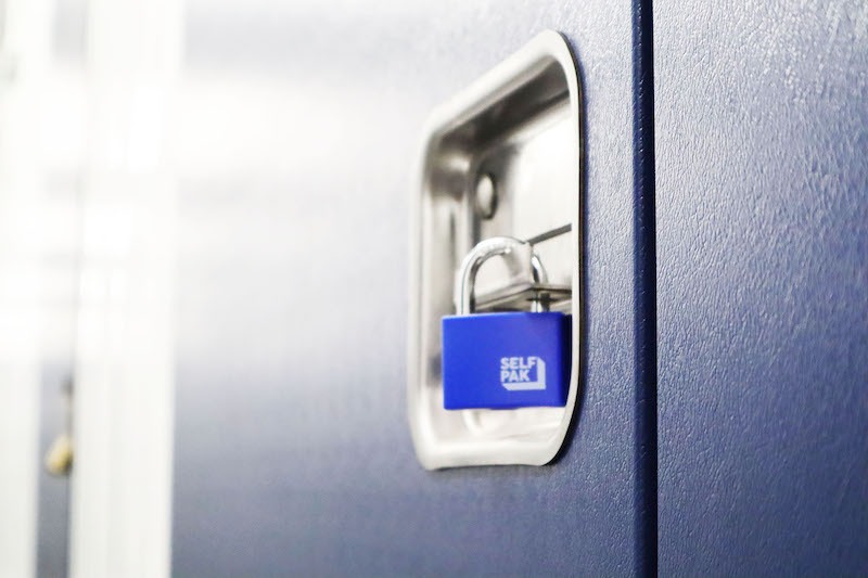 Storage units in St Ives. Image shows blue storage unit door with a blue padlock.