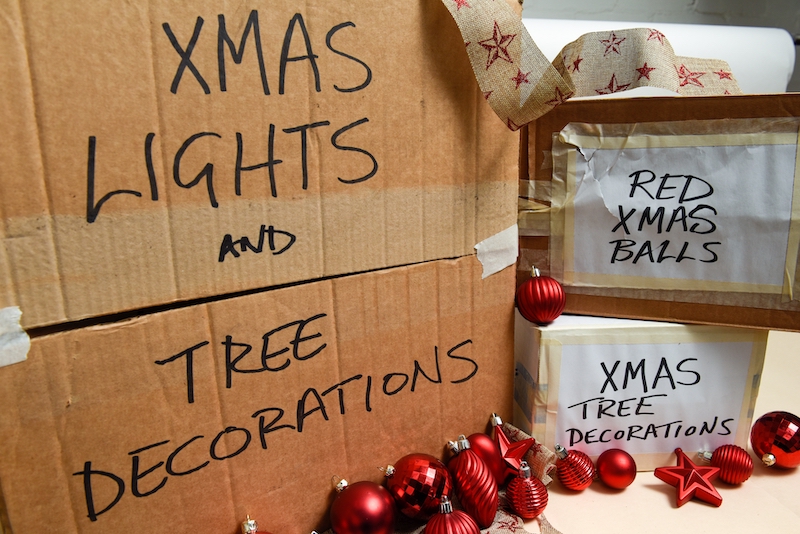 Self storage this Christmas. Image shows boxes and containers of festive Christmas lights and decorations