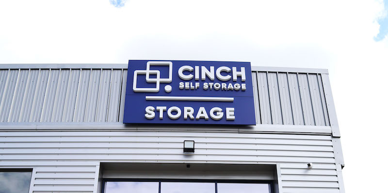 Storage units St Ives. Image shows exterior Cinch self storage blue sign.