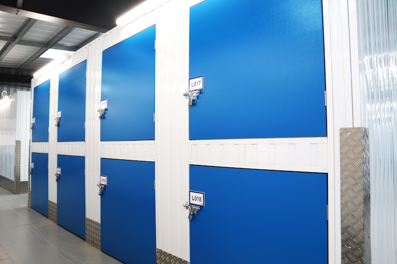 Small storage. Image shows locker shaped storage units with blue doors.