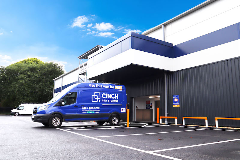 Short term storage Bedford. Image shows a Cinch Self Storage van parked outside a Cinch storage facility. 