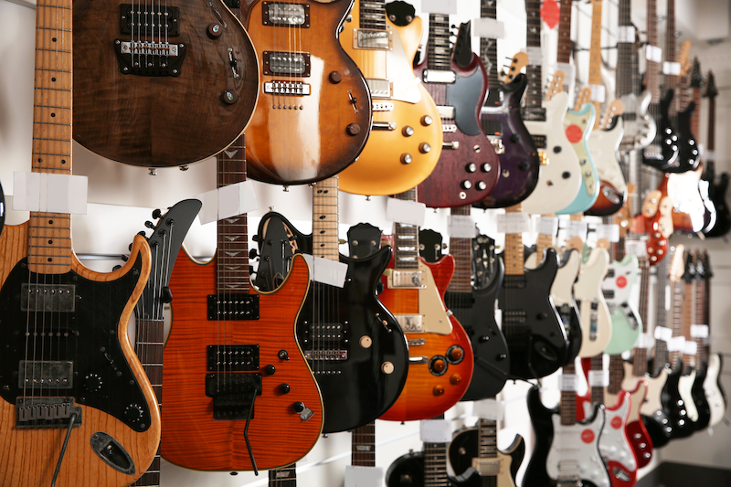 Storage units in Southend. Image shows a collection of guitars hung up on a wall.