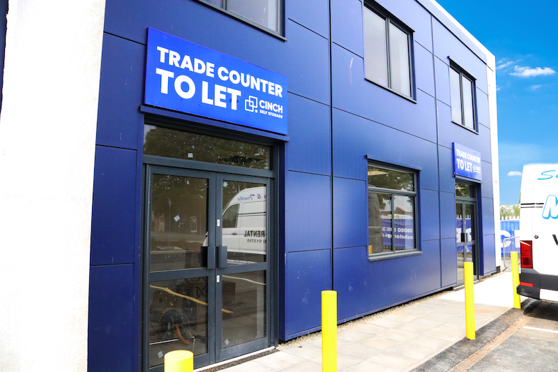 What is a trade counter. Image shows the external view of a Trade Counter to let building with blue signage.
