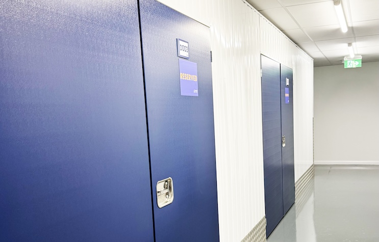 Swindon long term storage. Image shows the blue door of a storage unit with a reserved sign on it.