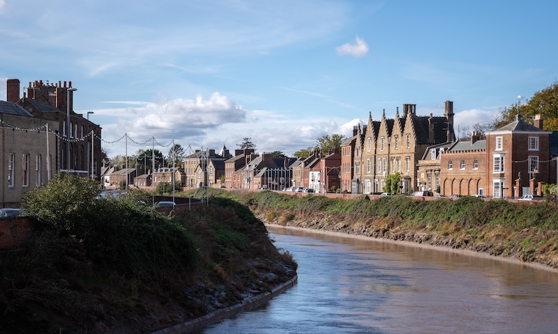 Is Wisbech a nice place to live. Image shows Georgian buildings along the banks of the River Nene in Wisbech, Cambridgeshire, England.