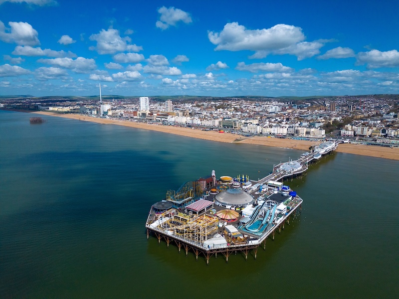 Why you should choose Brighton for your startup or business. Image shows an aerial view of Brighton beach and pier.