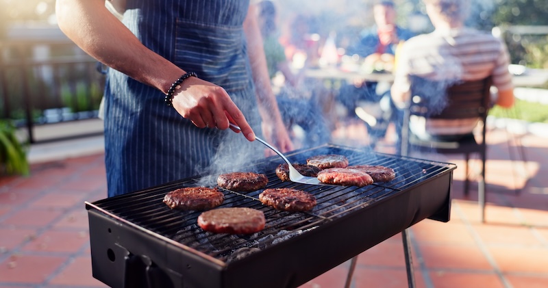BBQ storage. Image shows a man bbq-ing burgers.