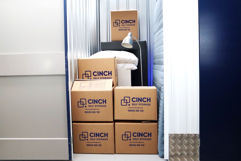 Long term storage Letchworth. Image shows a small locker filled with boxes and homewares.