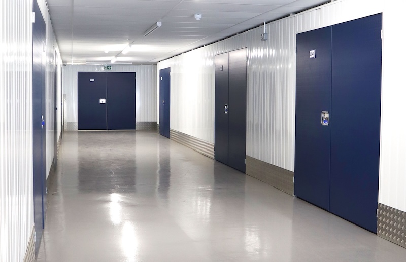 Self storage Leighton Buzzard. Image shows interior view of a corridor of storage units.