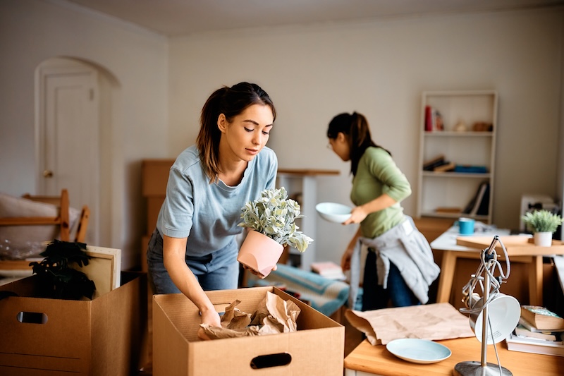 Short term storage Chippenham. Image shows two women unpacking their things while moving into a new home.