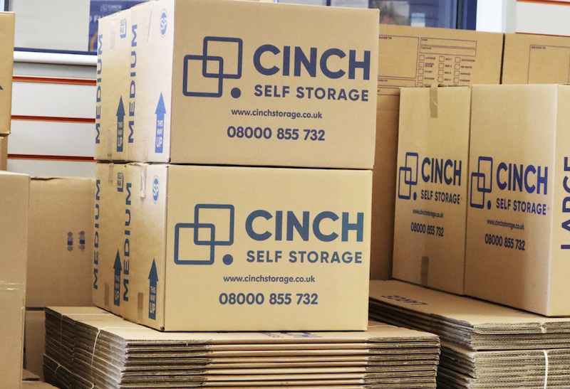 Short term storage Letchworth. Image shows a pile of Cinch Self Storage cardboard boxes.