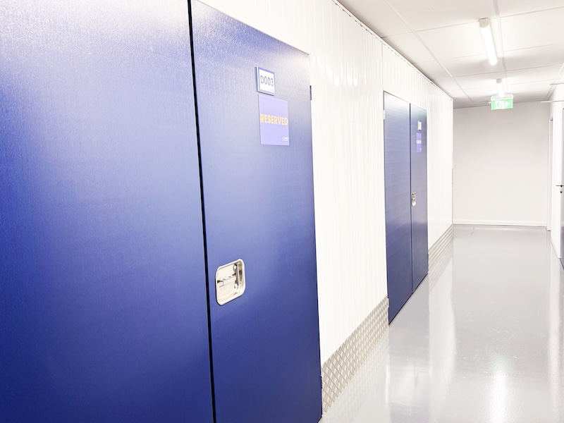 Storage rooms in Swindon. Image shows a blue storage unit door with a reserved sign on it.