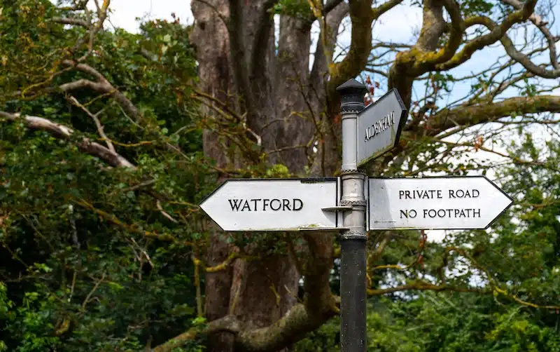 Self storage for Watford and surrounding areas. Image shows an old fashioned sign pointing towards Watford.