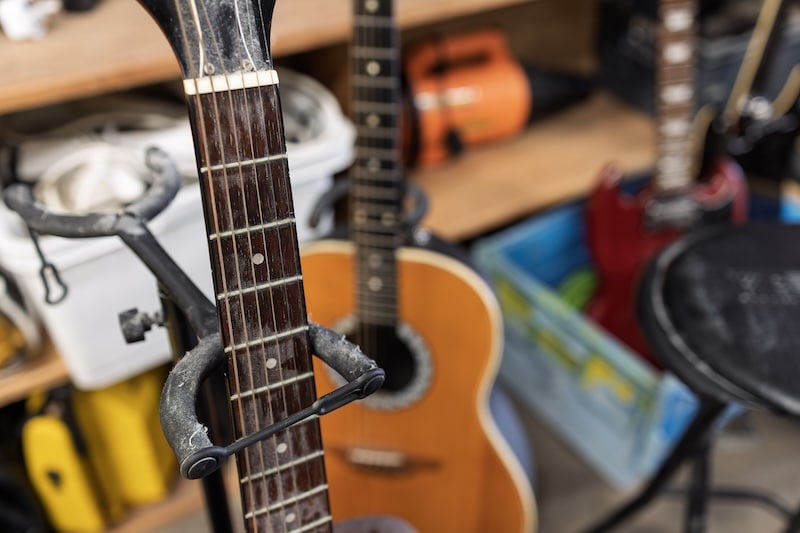Exeter storage. Image shows a close view of acoustic guitars stored in a storage unit.