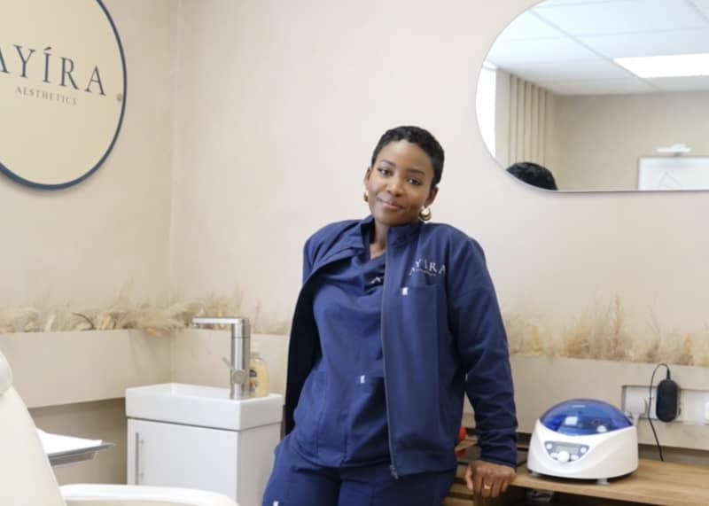 Ayira Aesthetics. Image shows the founder Napolina in her office at Enfield Cinch Self Storage. 