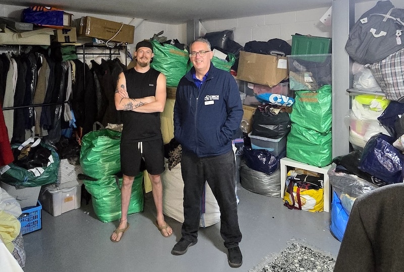 Trade loft case study. Image shows the owner of Trade Loft Jamie with the Cinch Self Storage Chippenham manager inside Trade Loft's storage unit. 